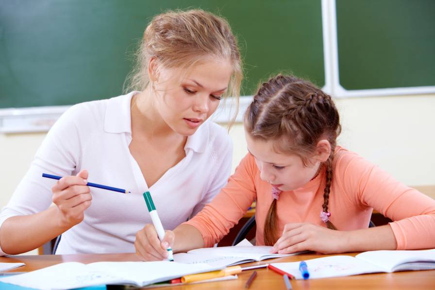 Teacher and girl working